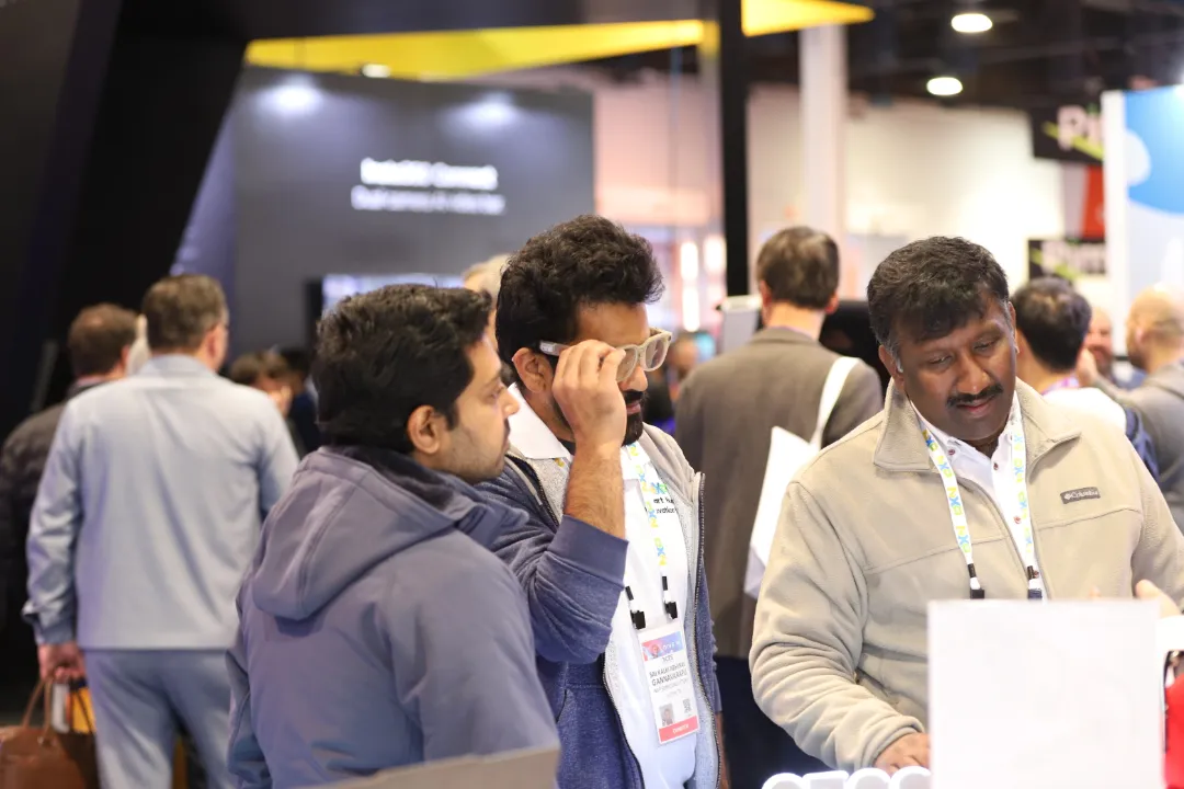Visitors trying إدور AI glasses at CES 2025 booth