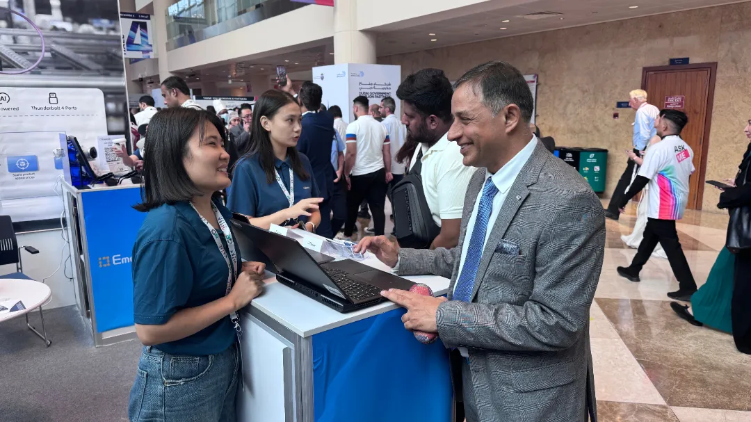 إدور staff showcasing AI products to visitors